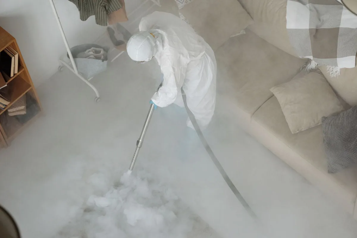 Biohazard cleanup technician in protective equipment, Hampton Manor, NY